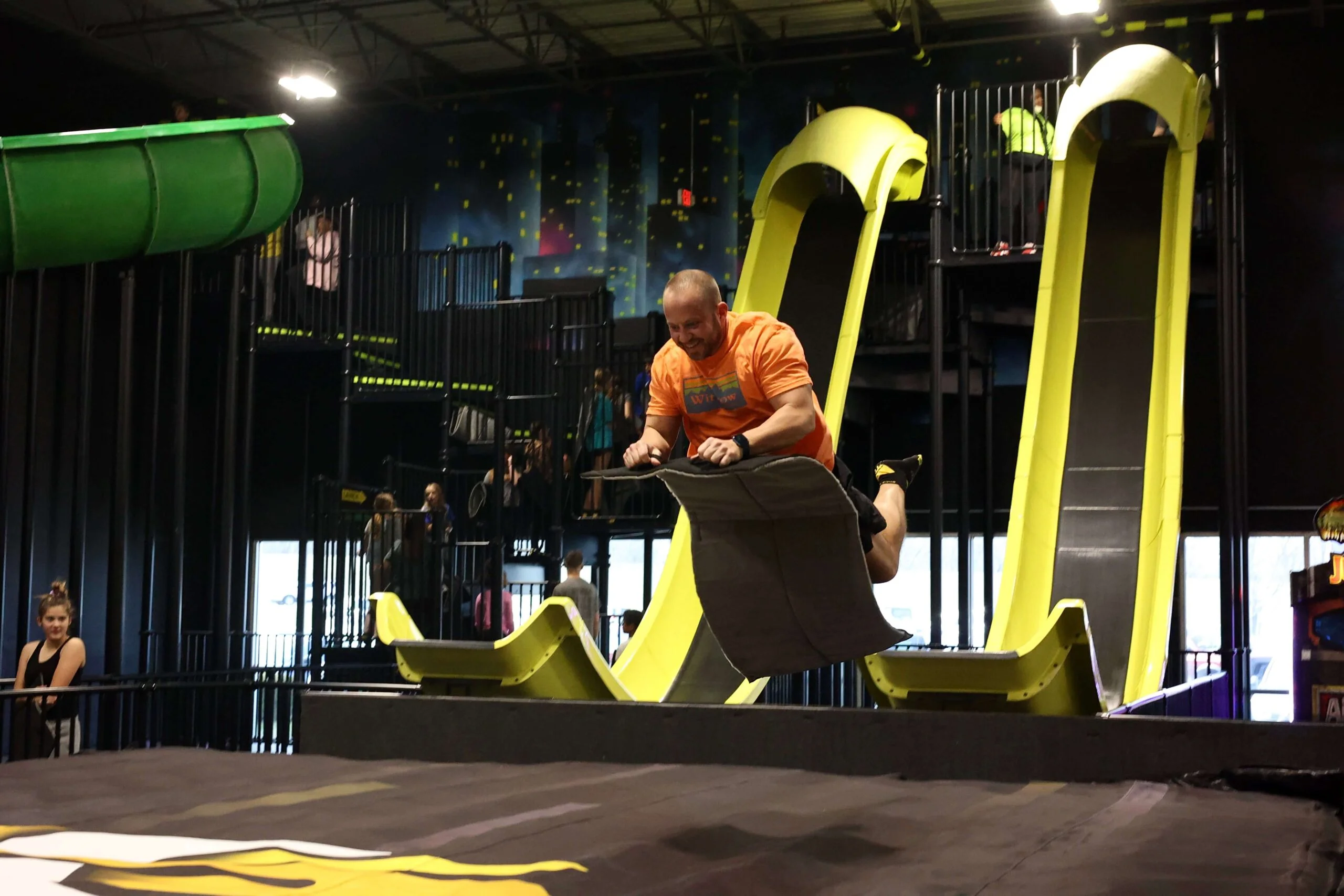 adult on slide in air